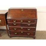 A Georgian mahogany bureau, the fall front opening to reveal an interior arrangement of drawers