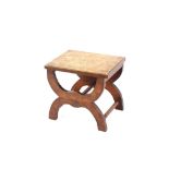 An oak stool, raised on U shaped supports united by chamfered stretchers, 47cm