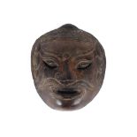 An unusual Eastern bronze mask, 18cm