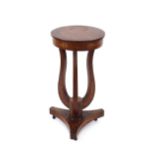 A 19th Century mahogany and marquetry decorated jardiniére stand, the circular top raised on