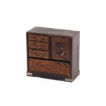 A small Japanese lacquered and parquetry decorated trinket cabinet, 15cm wide x 13.5cm high
