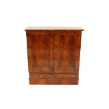 A Victorian walnut side cabinet, the interior shelves enclosed by a pair of moulded panel doors,
