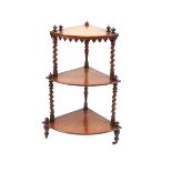 A Victorian walnut three tier graduated corner whatnot, raised on barley twist supports, 58cm wide