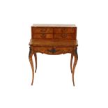 A 19th Century French walnut bonheur de jour, having raised upper section, fitted four drawers,