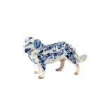 A faience ware model of a dog, 22cm long