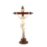 An Antique ivory wooden and white metal mounted crucifix, 42cm high
