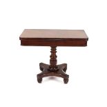 A William IV mahogany tea table, the rectangular fold over top raised on a baluster column and