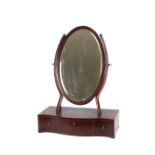 A 19th Century mahogany boxwood strung and chequer-banded swing toilet mirror, the oval bevelled