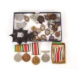 A collection of various medals, Police badges, cap badges etc.