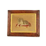 A woolwork embroidery of a seated spaniel, in burr maple cushion frame, 24.5cm x 32.5cm