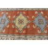 A large Eastern carpet, in the Caucasian manner, approx. 10ft 9ins x 15ft 11ins