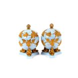 A pair of Grainger & Co., Worcester orb shape vases and covers, crown finials, gilt overlaid leaf