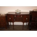 A mahogany and ebony strung bow fronted sideboard, in the George III manner, fitted central drawer