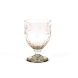 A large 19th Century etched glass goblet, having foliate and fruit decoration, raised on a