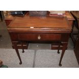 An 18th Century mahogany and cross-banded triple games table, the baize lined top with sunken