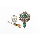 A decorative green and white stone set pendant brooch; an opal set stick pin and a 9 carat gold