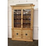 A 19th Century pine kitchen dresser, the upper section enclosed by a pair of glazed leaded panel