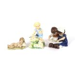 A Bing & Grondahl figure of two children reading a book; a Lladro figure of a sleeping baby; and