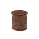 A Chinese carved bamboo brush pot, decorated with flowerheads and leaves, six character mark, 17cm