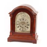 An Edwardian mahogany cased chiming mantel clock, the silvered dial with strike silent subsidiary,