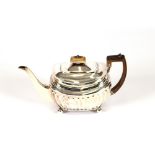 A George III silver teapot, having half fluted body decoration, bone handle and lift raised on