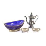 A pair of oval white metal salts, raised on scrolled feet; a Sheffield plated oval bread basket; and