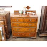 A 20th Century walnut chest, of two short and three long graduated drawers, raised on bracket