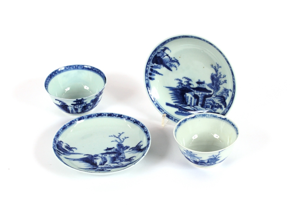 A pair of Nanking Cargo tea bowls and saucers, with original certificate and boxes