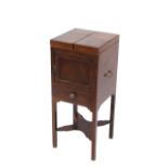 A 19th Century mahogany wash stand, fitted with a folding two section top, cupboard and drawer
