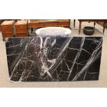 An imposing marble side table, having white veined black rectangular top on a grey oval section