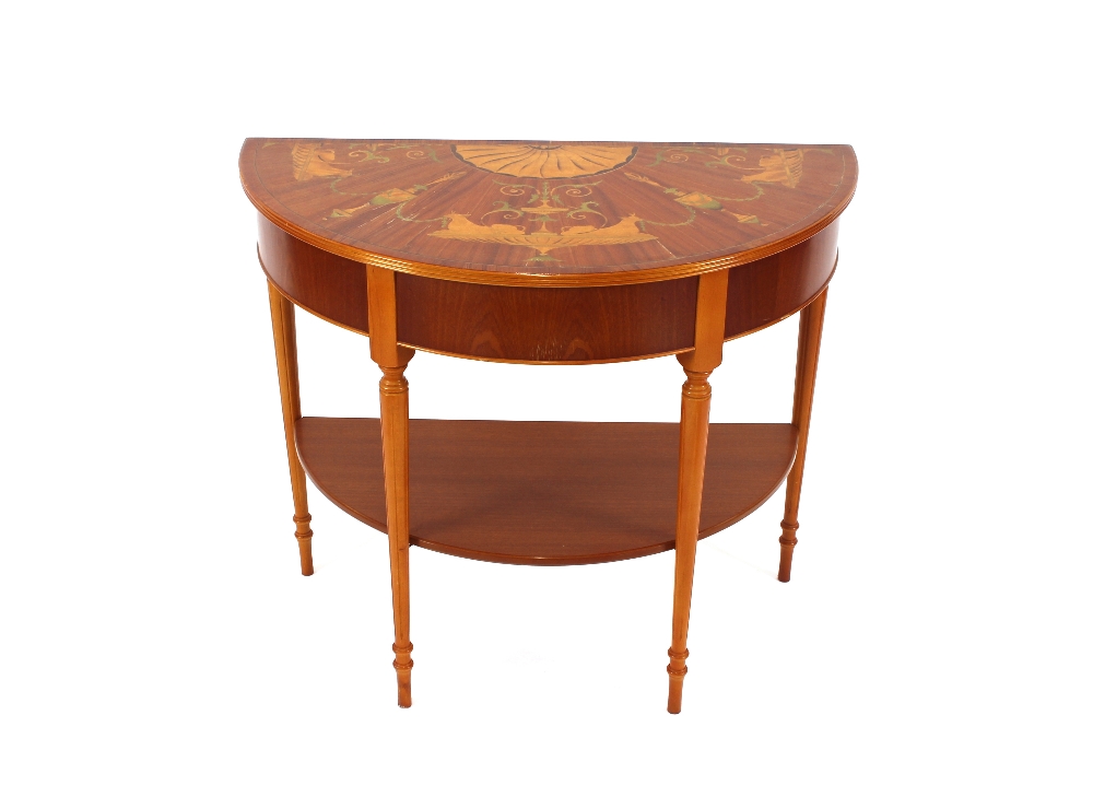 A Sheraton style demi-lune two tier side table, with marquetry style decoration, 90cm wide