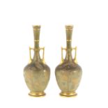 A fine pair of Worcester "patent metallic" baluster vases, the elongated necks having floral