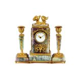 A 19th Century French Fluorspar and ormolu clock garniture, the timepiece surmounted by doves