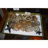 A tray of military hat badges