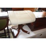 A white leather upholstered foot stool