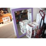 A purple painted pine framed wall mirror