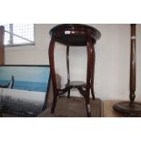 A mahogany oval topped side table