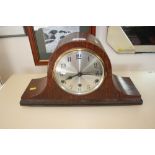 An oak cased three hole mantel clock