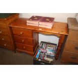 A pine kneehole desk fitted three drawers