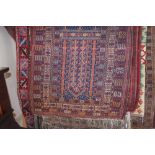 An approx 4'10" x 3' Caucasian patterned rug