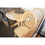 A beech drop leaf table; together with a pair of sp