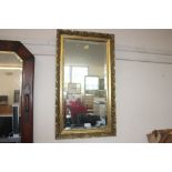 A gilt framed bevel edged wall mirror