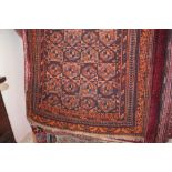 An approx 4'4" x 3'1" Eastern orange patterned rug