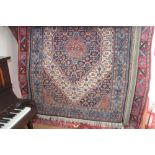 An approx 6' x 4' blue floral patterned rug