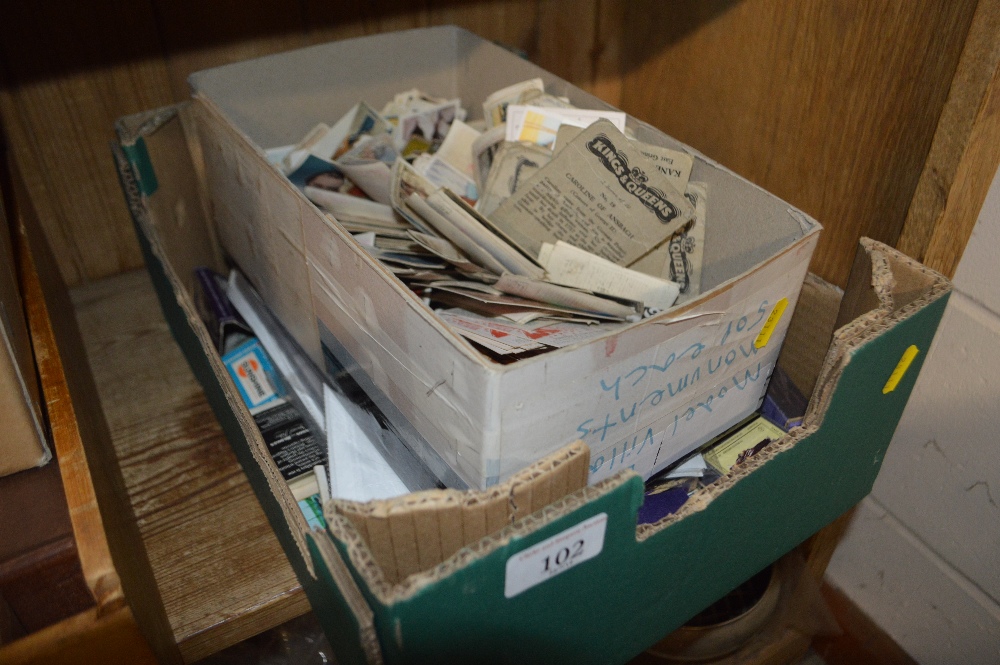 A box of collector's cards and match boxes etc.