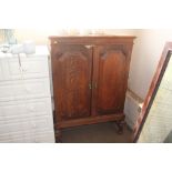 An oak two door cupboard