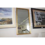 A gilt framed oblong mirror