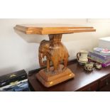 A carved hardwood elephant occasional table