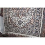 An approx. 5' 4" x 3' 11" floral patterned rug