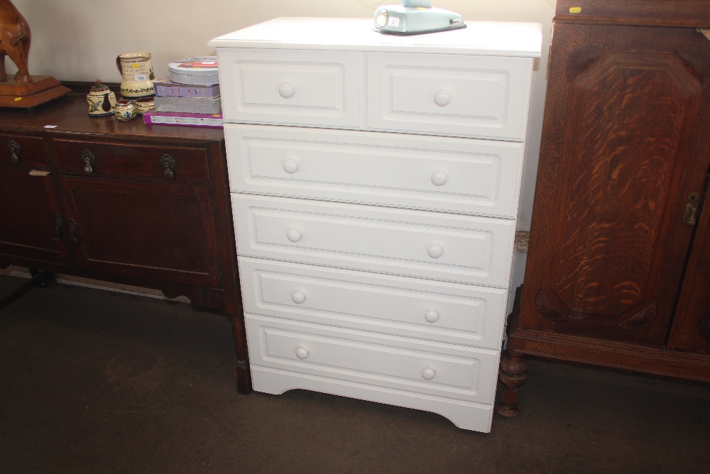 A modern white melamine chest fitted five long dra